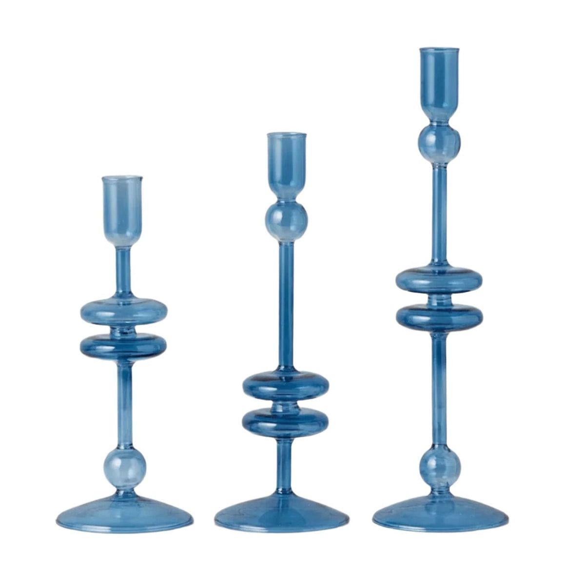 Three elegant sapphire blue glass candlesticks in varying heights, featuring a modern, stacked design.