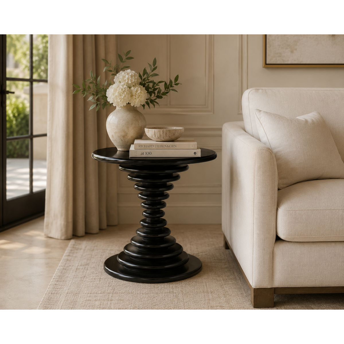 Schilling round side table with hand-rubbed black finish and concentric ring design.