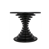Schilling round side table with hand-rubbed black finish and concentric ring design.