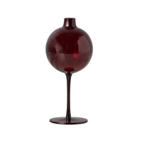 Dark red glass vase on a white background