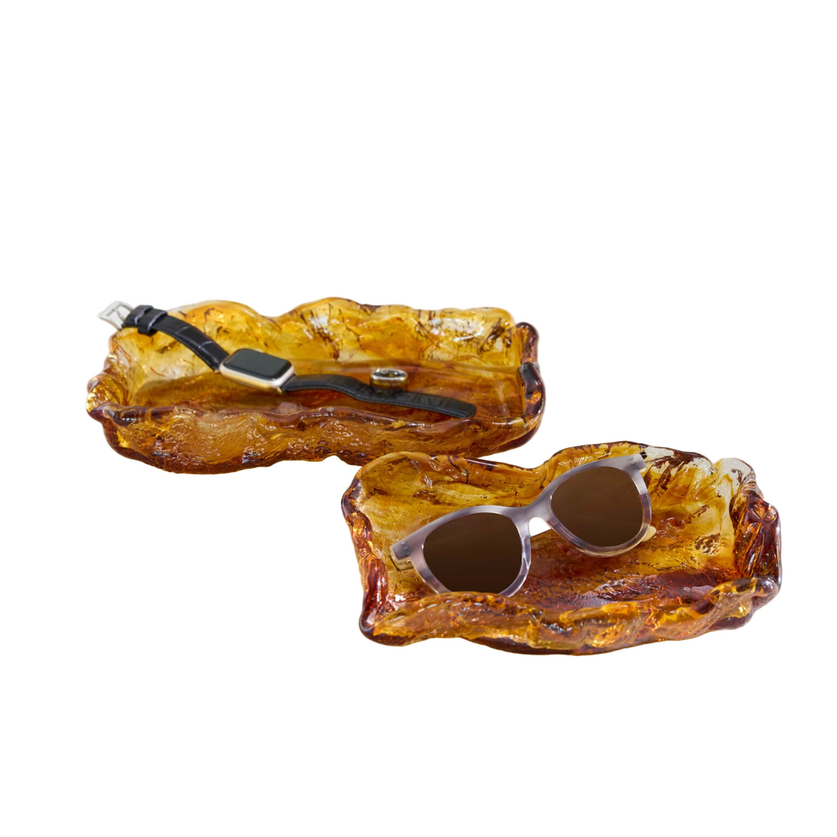 Ambered colored glass bowls with accessories placed inside