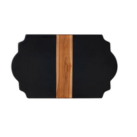 Black and wood cutting board on a marble surface with a white background