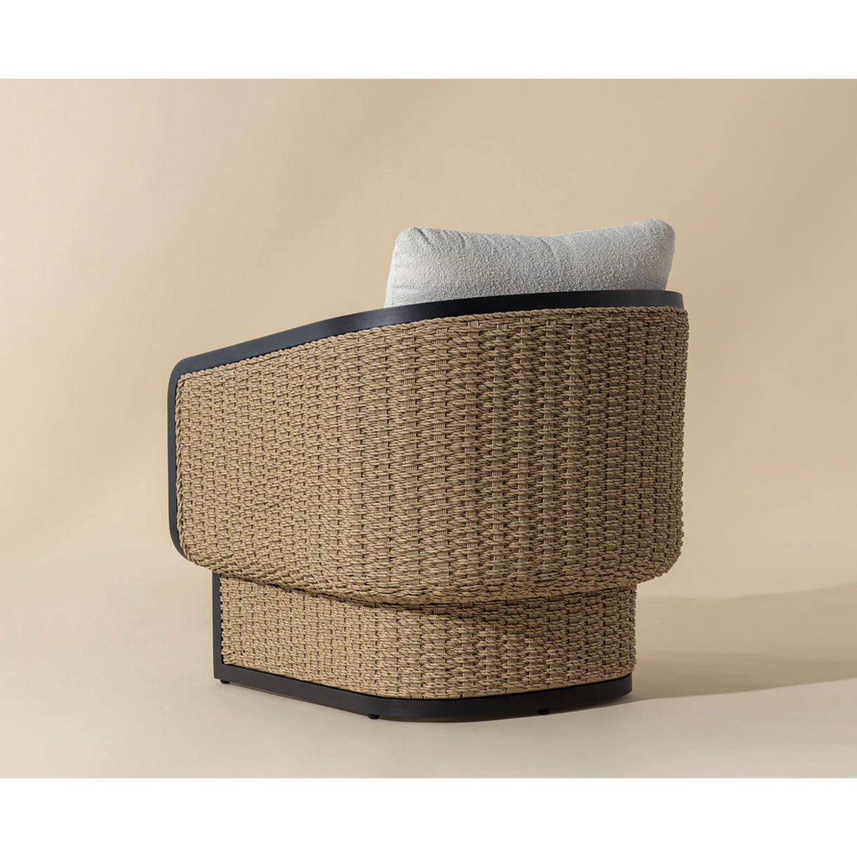 Woven chair with a cushion on a beige background