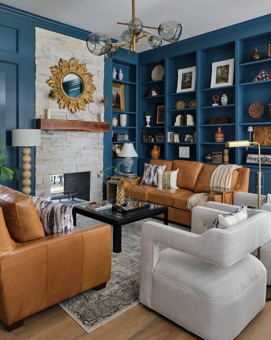 Chandelier over modern furnished living room. 