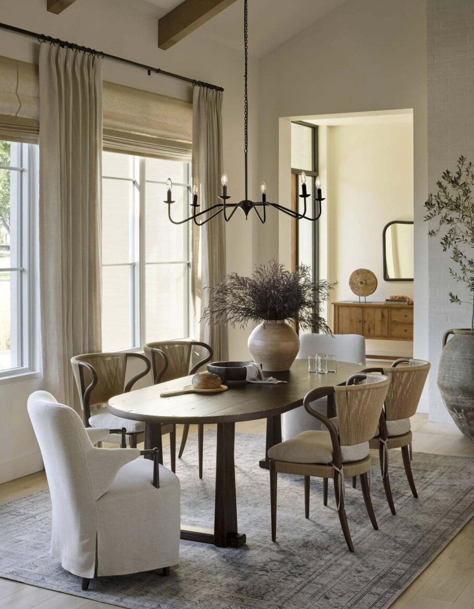 Modern dining room featuring table with 6 chairs. 