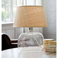 Seeded oval glass table lamp with a natural rattan tapered shade, 23.5" tall.