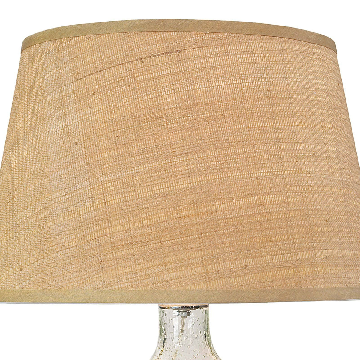 Seeded oval glass table lamp with a natural rattan tapered shade and polished nickel hardware.