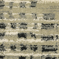Close-up of Seneca Beige & Grey Casual Rug, showing dense polypropylene pile with abstract black, ivory, and grey patterns.