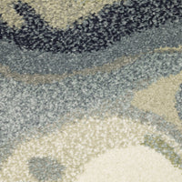 Close-up of Seneca Blue & Green Contemporary Rug, showing dense, super-soft polypropylene pile with abstract blue, green, and ivory patterns.