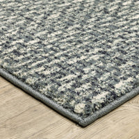 Seneca Blue & Ivory casual polypropylene rug with modern organic geometric design on wood floor.