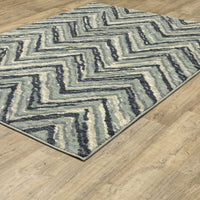 Seneca Blue & Ivory Chevron Rug with dense, high-pile polypropylene texture on a wood floor.