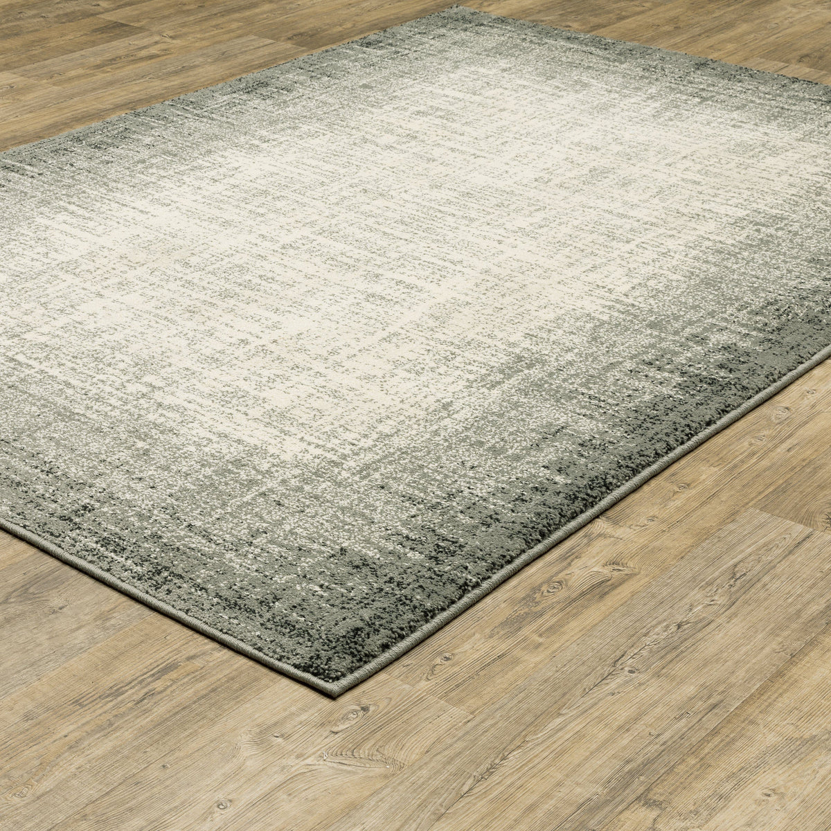Seneca Grey & Beige Gradient Rug with a modern, organic geometric design on a wood floor.
