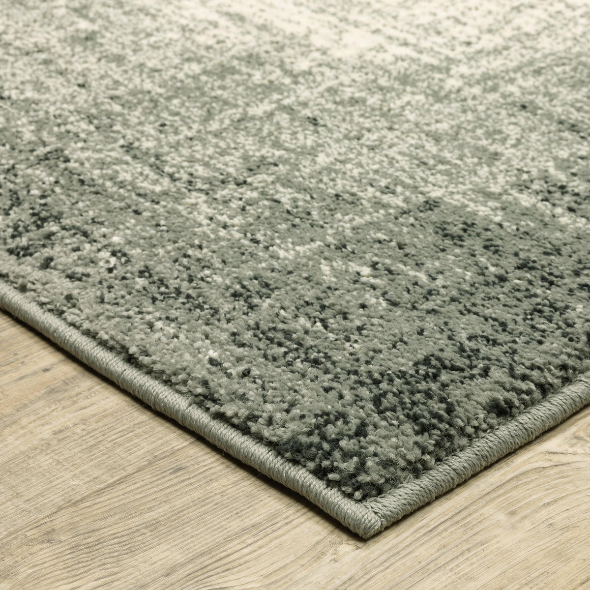 Close-up of a Seneca Grey & Beige Gradient Rug with a soft, high-pile polypropylene texture and organic geometric design.