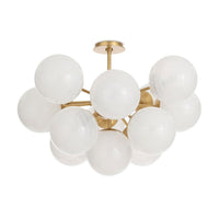 Shine Flush Mount with white swirled glass spheres and natural brass accents.