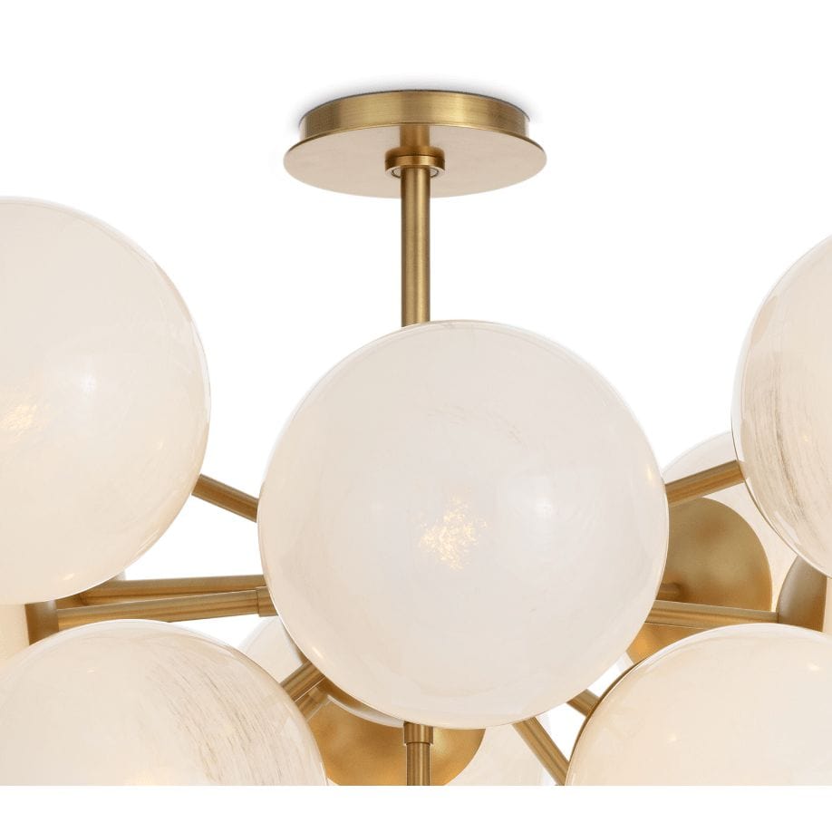 Shine Flush Mount with white swirled glass spheres and polished natural brass accents.