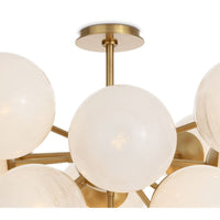 Shine Flush Mount with white swirled glass spheres and polished natural brass accents.