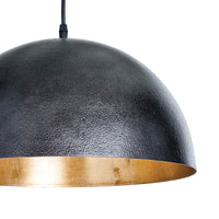 Sigmund Small Black Gold pendant light, a simple dome shade with a textured black exterior and gold-leafed interior.