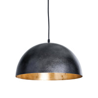 Small black dome pendant light with a gold-leafed interior, hanging from a black cord.