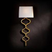 Elegant Sinuous Sconce with gold leaf metal twisting pattern and a natural linen shade.