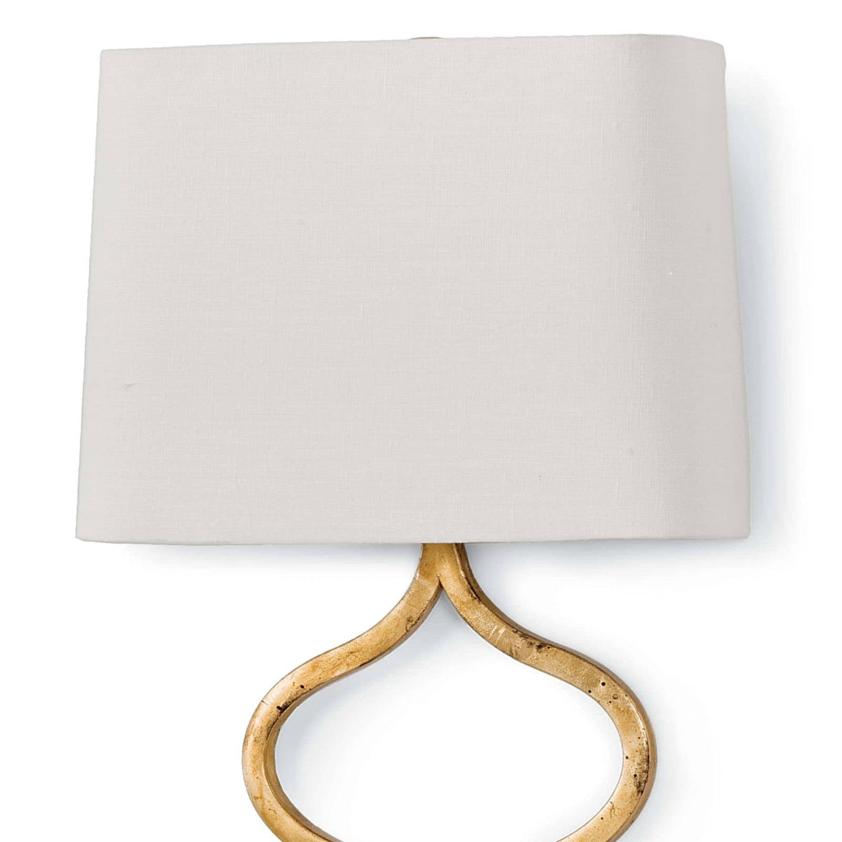 Elegant Sinuous Sconce with a gold leaf finish and a natural linen shade.