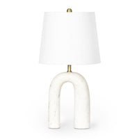 Slinkly Marble Table Lamp with an arched white marble base, brass accents, and a white linen shade.