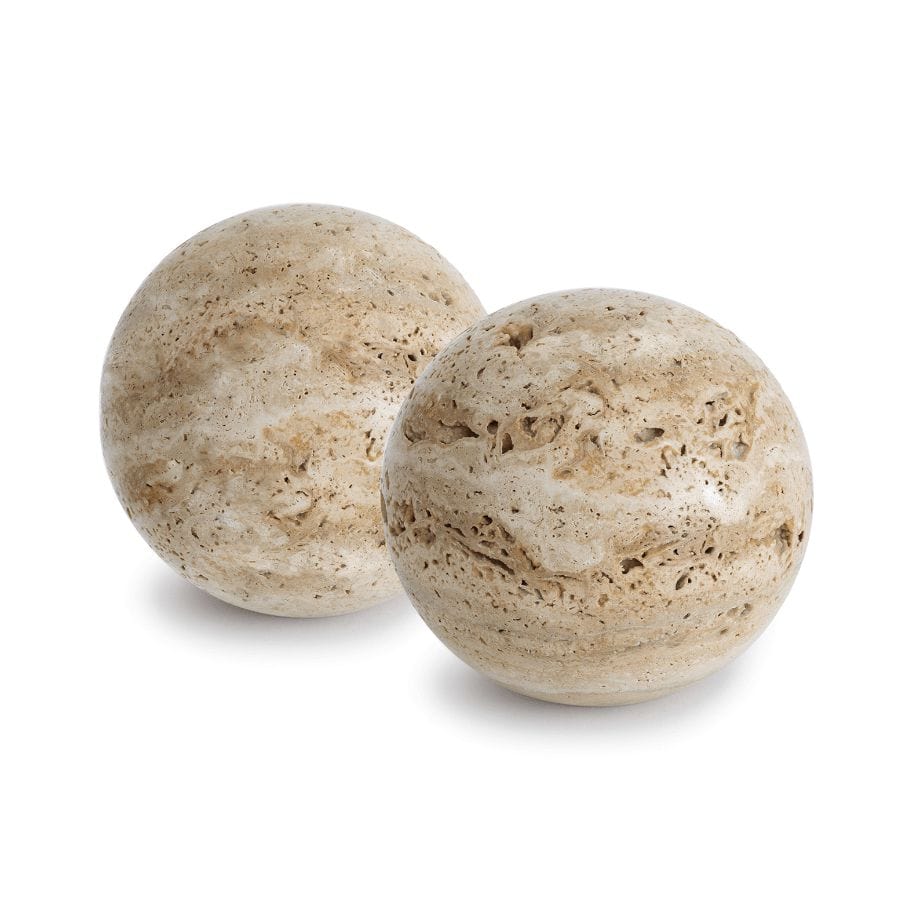 Two round Sloane Travertine Bookends, light beige with natural porous texture, on a white background.