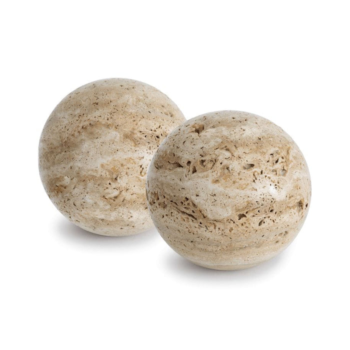 Two round Sloane Travertine Bookends, light beige with natural porous texture, on a white background.