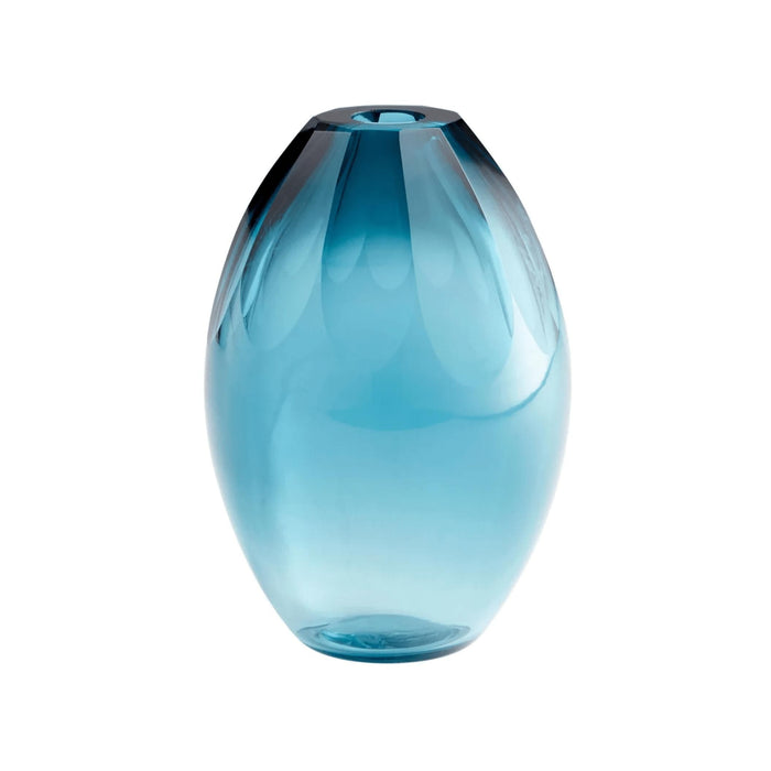 Small ocean blue glass vase with an elegant, faceted design.