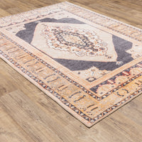 Sofia Gold & Charcoal Traditional Rug with distressed pattern on wood floor.