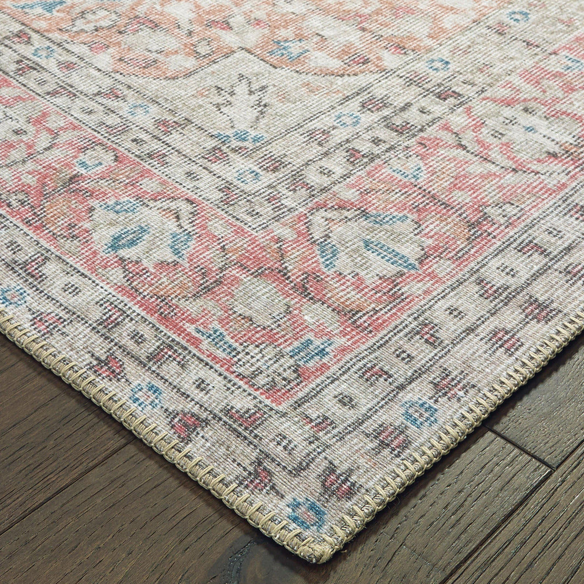 Sofia Ivory & Pink Traditional Rug with distressed pattern, machine-woven polyester chenille, and blanket stitch.