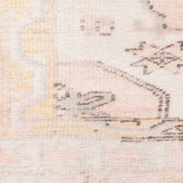Close-up of Sofia Pink Distressed Traditional Rug, showing vintage-inspired patterns in pink, peach, and yellow.