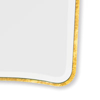 Sonnet dressing mirror with a gold-leafed frame and beveled glass, featuring simple curved corners.