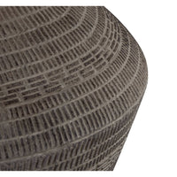 Close-up of the Soren Ceramic Table Lamp base, showing its dark gray earthenware look and unique etched pattern.