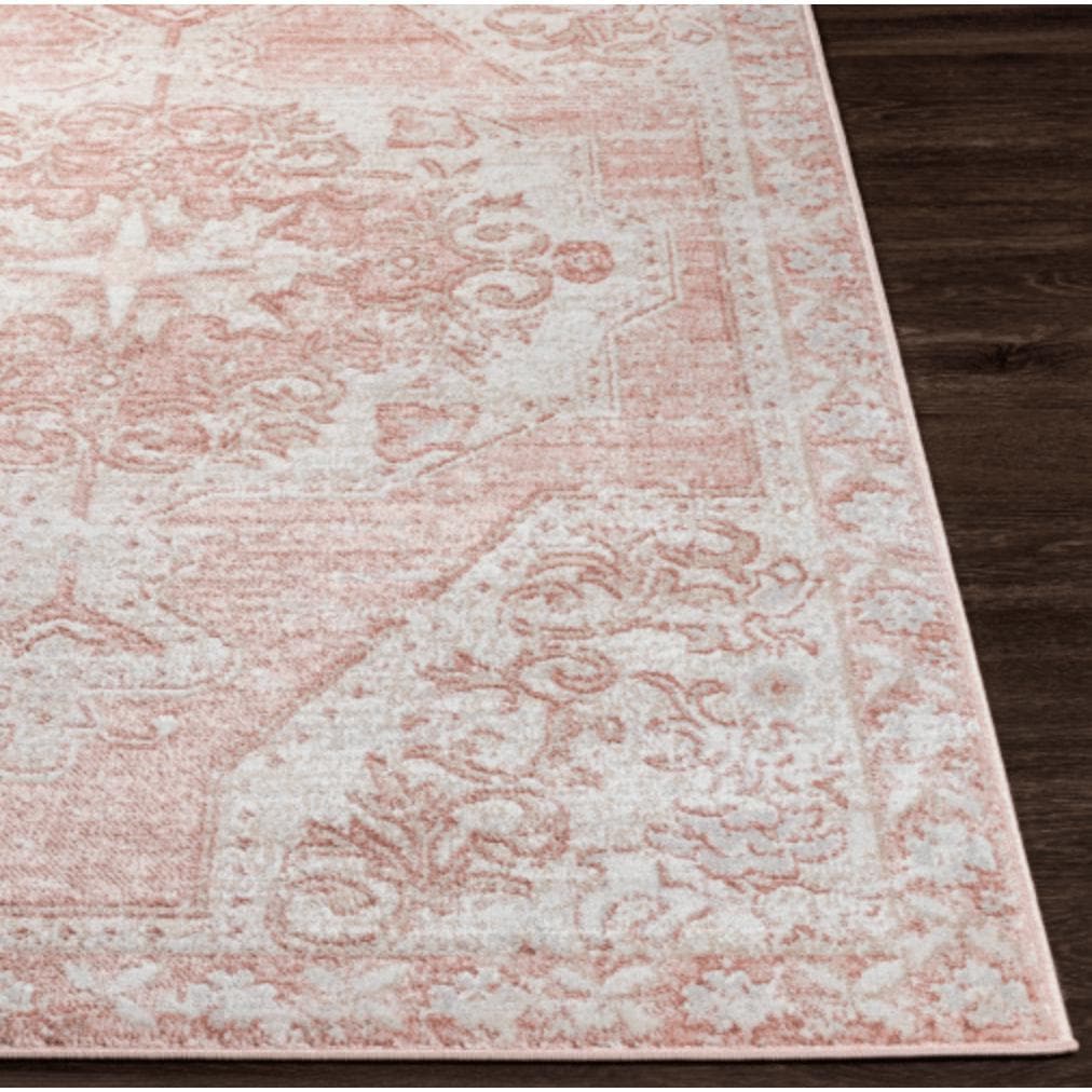St Tropez pale pink and beige traditional polypropylene rug with intricate floral patterns.