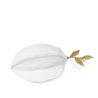 White starfruit metal objet with a textured surface and gold leaf accents.