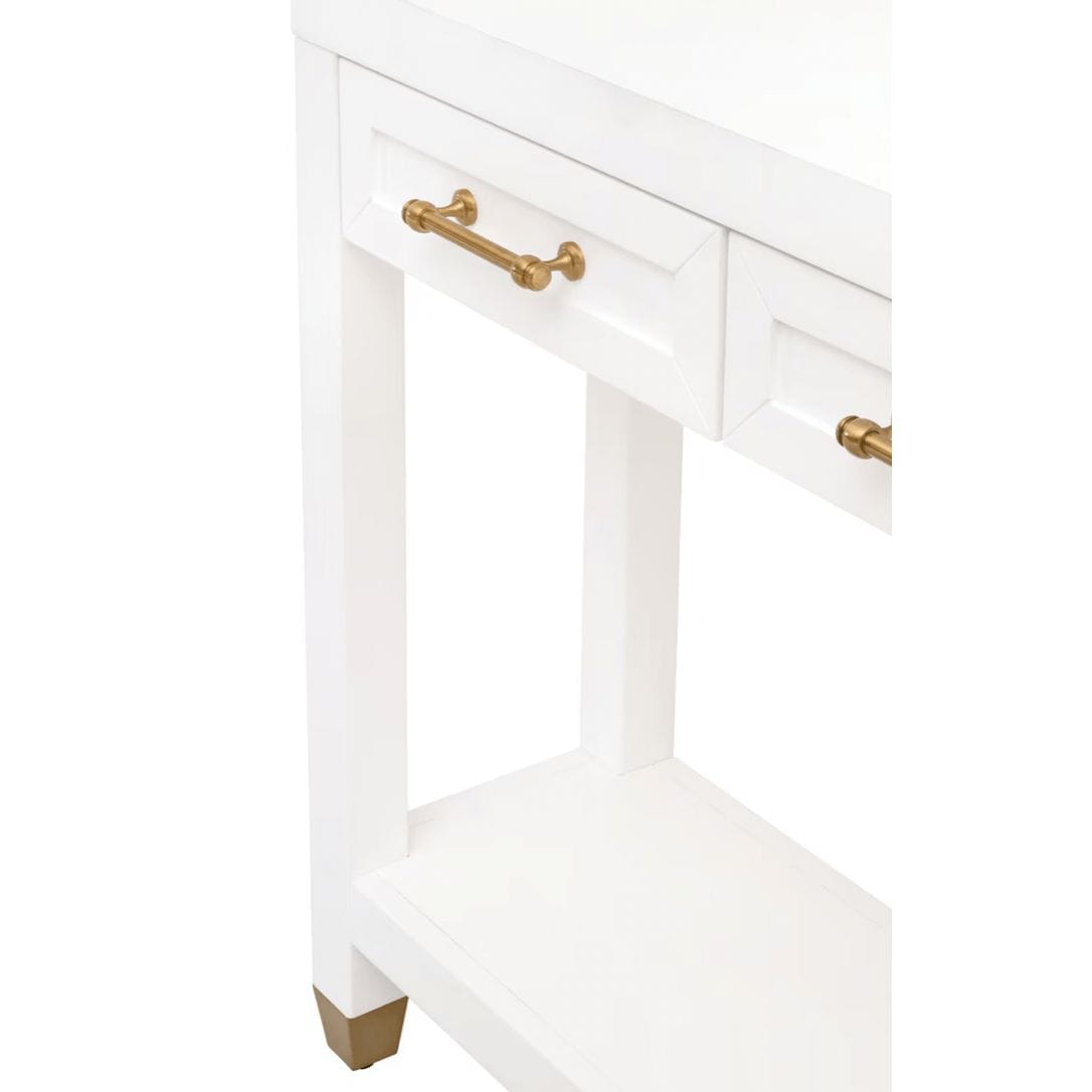 Stella matte white narrow console table with three drawers, gold pulls, and a bottom shelf.