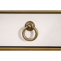 Close-up of pearl white faux shagreen desk drawer with brushed gold ring pull.