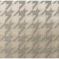 Beige mist throw pillow with a raised houndstooth pattern on a textured gray background.