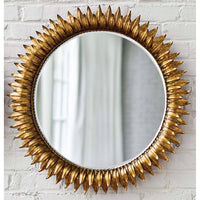 Antique gold leaf sunburst mirror with a beveled round mirror, 29" diameter.