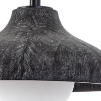 Ebony wood grain pendant light with a sleek shade and a white milk glass globe.