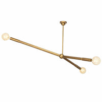 Talon Chandelier in natural brass with three adjustable arms and exposed G-type bulbs.