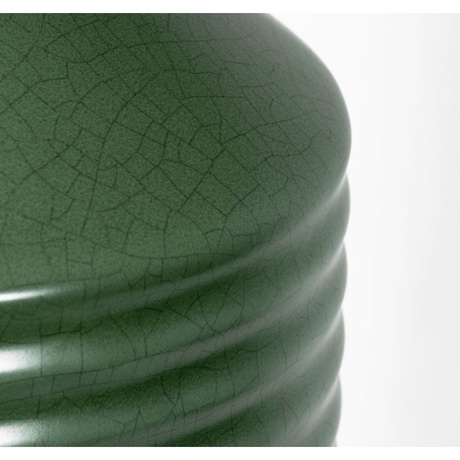 Close-up of a Temperance olive green ceramic table lamp base with ribbed texture and matte crackle glaze.