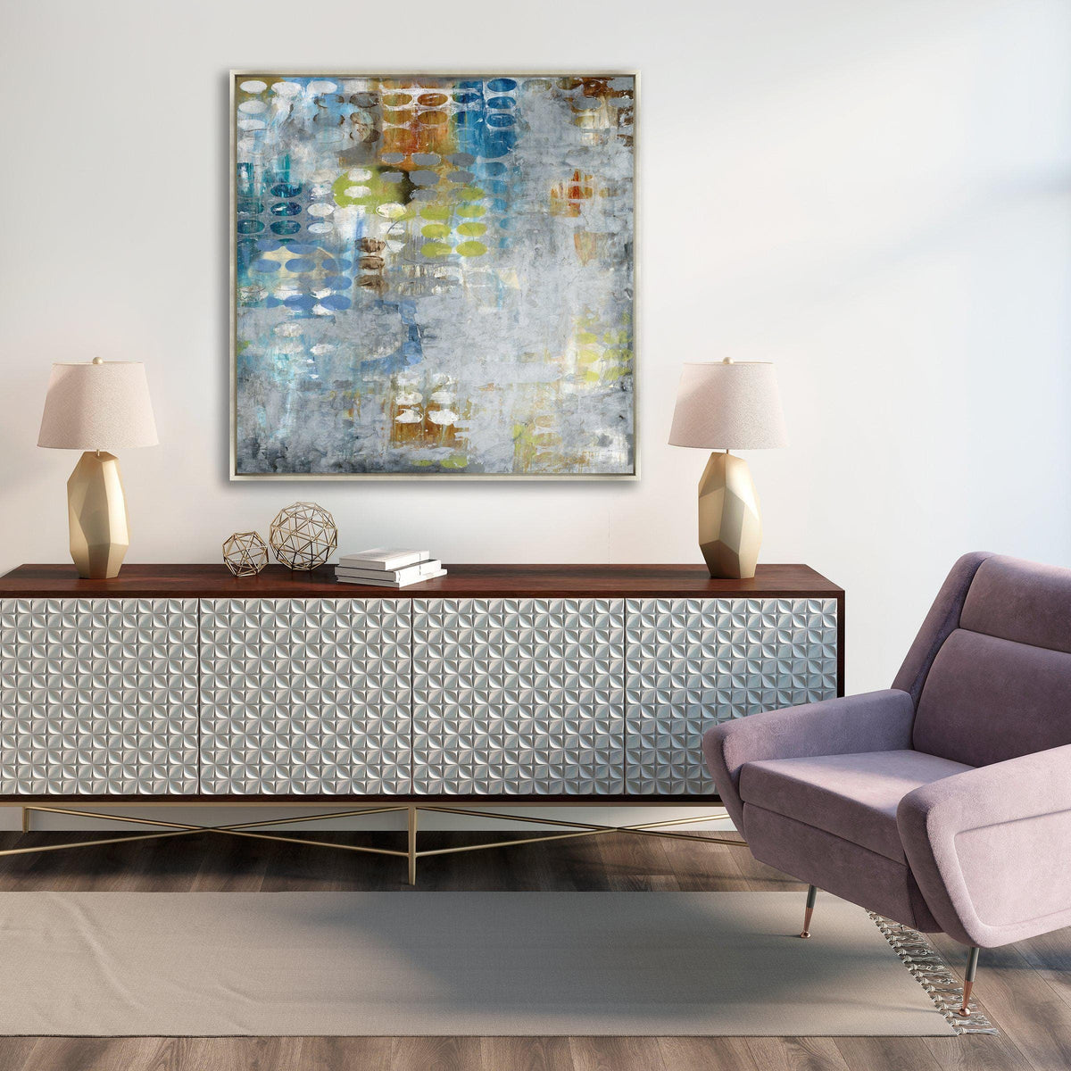 Abstract giclee canvas painting with blue, yellow, and white tones above a textured white console and purple chair.