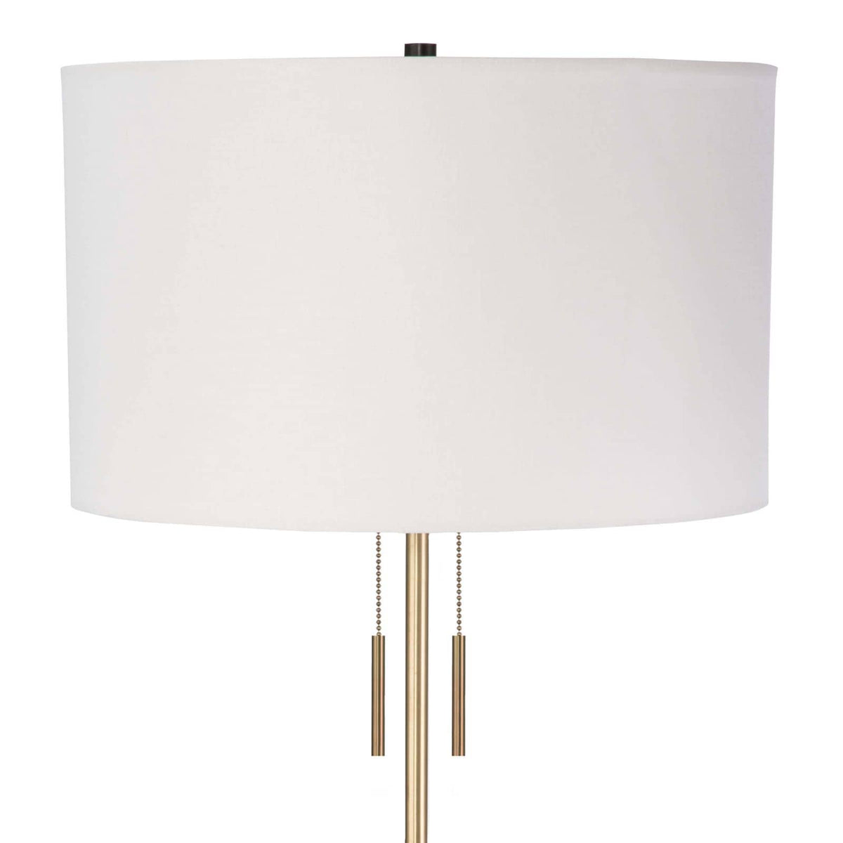 Theo Floor Lamp with a white linen shade, ebony birch wood, and brass accents.