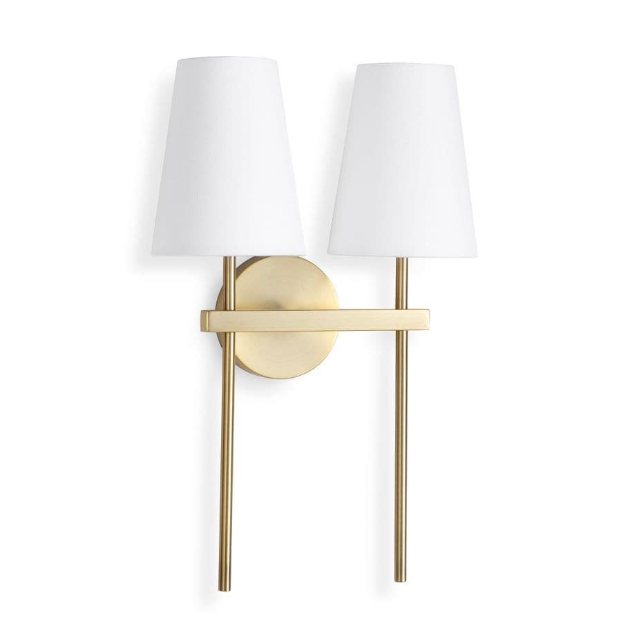 Toni Sconce Double: natural brass wall light with two white linen shades.
