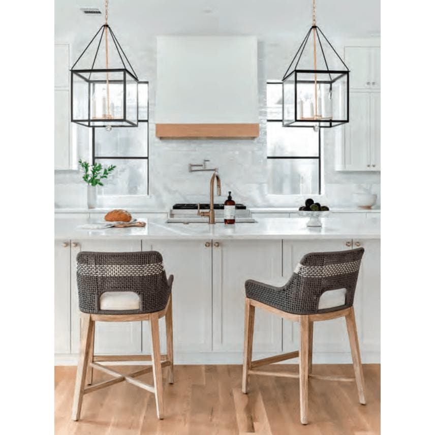 Two Tootsie Gray Rope Counter Stools with woven backs, gray teak legs, and white cushions in a modern kitchen.