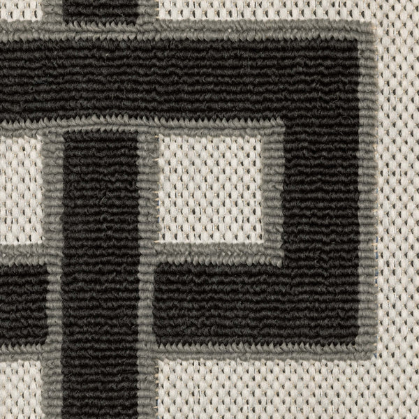 Close-up of Torrey Beige & Black Outdoor Rug, showing tri-colored loop pile pattern on a platinum flatwoven base.