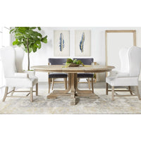 Torrey Natural Gray Acacia Extension Dining Table, round, with white wingback chairs and gray upholstered chairs.