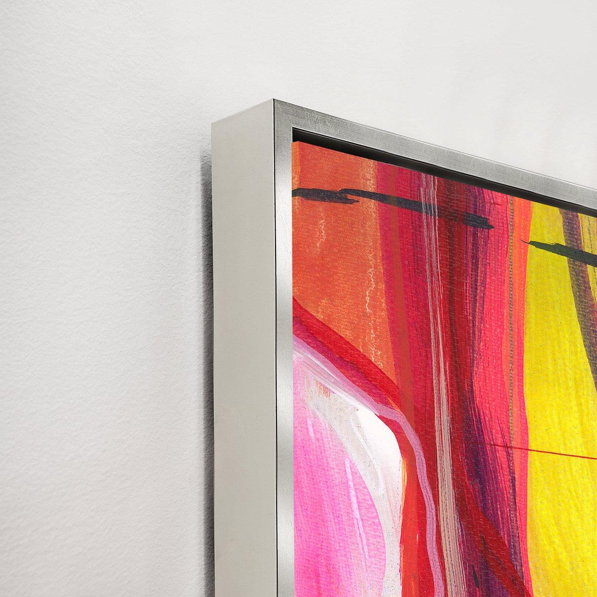 Close-up of "Traveling Through Eden" giclee canvas painting with vibrant reds, pinks, and yellows, in a silver frame.