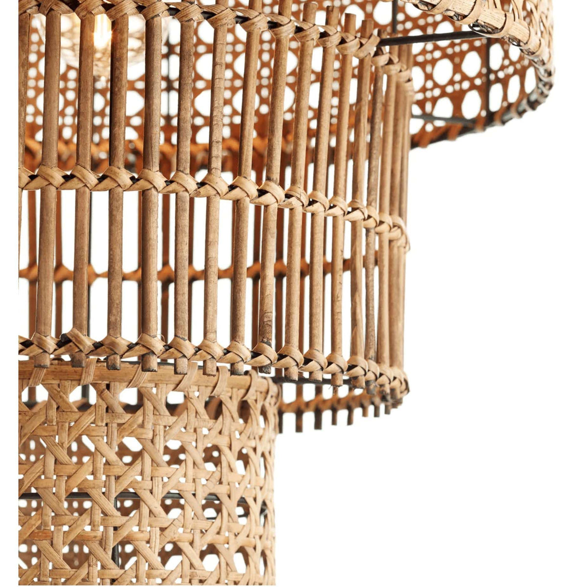Hand-woven, three-tier natural bamboo and rattan pendant light with exposed bulb.